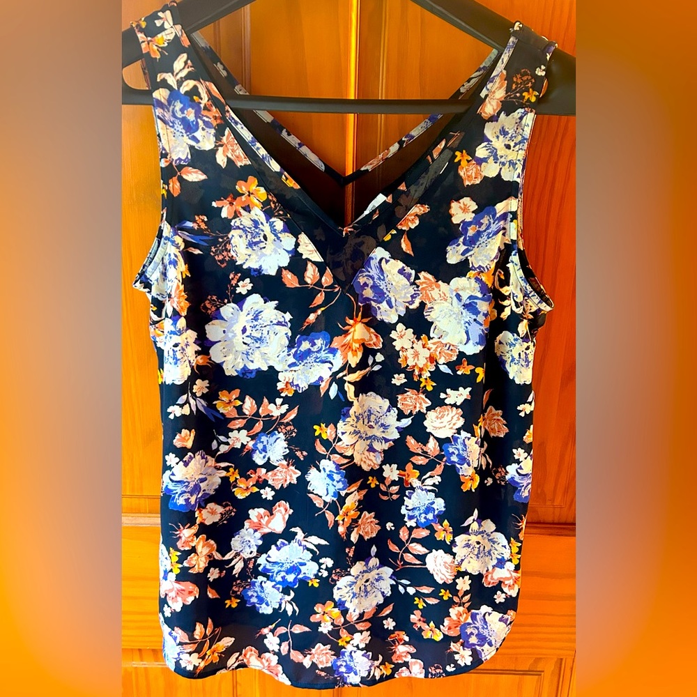 Maurice’s floral sleeveless blouse. In blues and corals